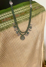 BIKHIPTA- TIMELESS ELEGANCE, BEIGE KHANDUA TUSSAR WITH REFRESHING GREEN BORDER