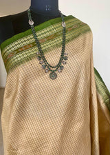 BIKHIPTA- TIMELESS ELEGANCE, BEIGE KHANDUA TUSSAR WITH REFRESHING GREEN BORDER