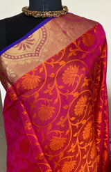 NITYA - A PURE COIMBATORE SILK SAREE IN SHOT COLOUR OF ORANGE AND PINK, FLORAL WOVEN PATTERN IN THE BODY AND A CONTRAST PURPLE AANCHAL