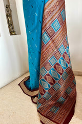 TANMAYA – BLUE BOMKAI SILK WITH RUDRAKSH AND MAROON TEMPLE BORDER