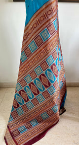 TANMAYA – BLUE BOMKAI SILK WITH RUDRAKSH AND MAROON TEMPLE BORDER