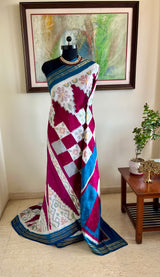PRABHATHI – WHITE PUTAPAKKA IKKAT WITH TEAL BLUE ZARI BORDER