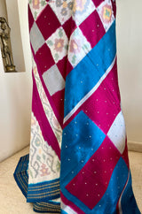 PRABHATHI – WHITE PUTAPAKKA IKKAT WITH TEAL BLUE ZARI BORDER