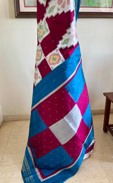 PRABHATHI – WHITE PUTAPAKKA IKKAT WITH TEAL BLUE ZARI BORDER