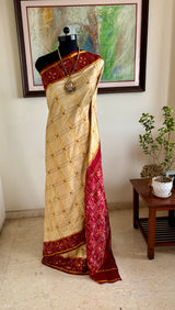 PRIYANGI – CREAM AND GOLD PATOLA WITH MAROON IKAT GEOMETRIC MOTIFS