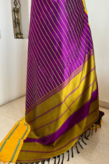 SHANKARI – VELDHARI KANJIVARAM IN RICH PURPLE WITH YELLOW BORDER DETAILS