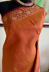 VAISHU – RUST BROWN KANJIVARAM SAREE WITH FLORAL ZARI BORDER