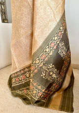 AADHIRA- BEIGE IKKAT SAREE ; FLORAL ELEGANCE, ZARI ACCENTS, TIMELESS ARTISTRY