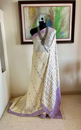 DIPANWITA – CREAM ASSAM SILK WITH ABUNDANT PURPLE FLORALS