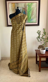 TAMARAI – OLIVE KANJIVARAM WITH STRIKING IKKAT MOTIFS