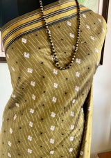 TAMARAI – OLIVE KANJIVARAM WITH STRIKING IKKAT MOTIFS