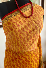 AVEYA- MUSTARD PURE GEORGETTE WITH BAGH PRINT CONTRASTS