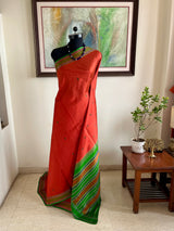 MAENIKA – RUST KANJIVARAM WITH GREEN BORDER AND AANCHAL