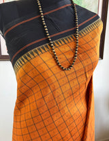 KALPINI — RUST KANJIVARAM SILK WITH BOLD BLACK CONTRASTS