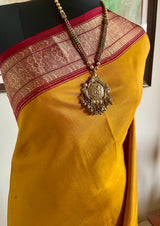 RIDHIRA – MUSTARD PATOLA WITH ELABORATE IKKAT AANCHAL