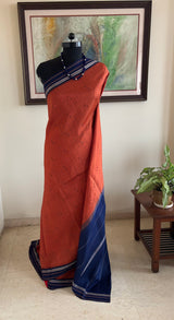 IRAAVATI – A RUST KANJIVARAM WITH STRIKING NAVY BLUE CONTRASTS