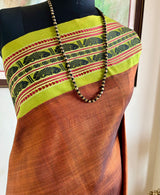 NIHIRIKA – RICH BROWN KORVAI WITH FISH & RUDRAKSHA MOTIFS