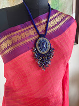 MEDHIKA – CORAL PINK GADWAL WITH PURPLE ZARI PAISLEY BORDER