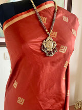ATASI – RICH RUST BANARASI WITH FLORAL ZARI AANCHAL