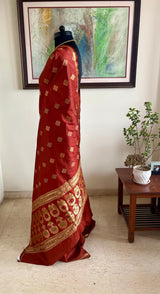 ATASI – RICH RUST BANARASI WITH FLORAL ZARI AANCHAL