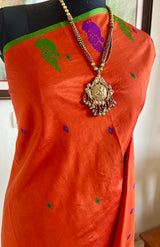 MRIDULIKA – RUST KANJIVARAM WITH REGAL PEACOCK WEAVES