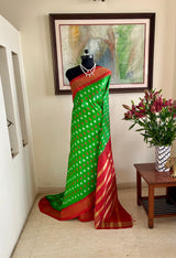 JAYINI- LEAF GREEN PATOLA SILK WITH RED AND GOLD ZARI AANCHAL