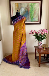 SUSHWETA- OCHRE KHANDUA SILK WITH BANDHA AND FLORAL MOTIFS