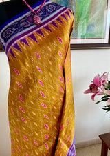 SUSHWETA- OCHRE KHANDUA SILK WITH BANDHA AND FLORAL MOTIFS