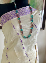 DIPANWITA – CREAM ASSAM SILK WITH ABUNDANT PURPLE FLORALS