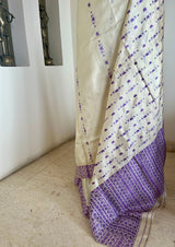 DIPANWITA – CREAM ASSAM SILK WITH ABUNDANT PURPLE FLORALS