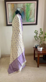 DIPANWITA – CREAM ASSAM SILK WITH ABUNDANT PURPLE FLORALS