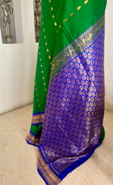 ROCHISHA – GREEN KANJIVARAM WITH PURPLE TEMPLE MOTIF BORDER