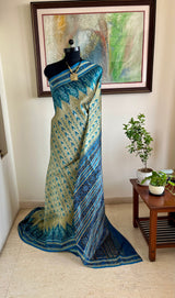 NILOTAMA – LIGHT BEIGE KHANDUA WITH BLUE IKKAT AANCHAL