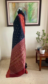 NIRUJA – STRIKING BLACK KHANDUA WITH CLASSIC RED BANDHA DETAILS