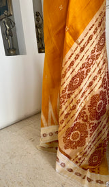 ELINAA – OCHRE ODISHA HANDLOOM WITH FLORAL BANDHA AND TEMPLE MOTIFS