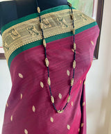 KOMATHI — DEEP MAROON KANJIVARAM WITH A DISTINCTIVE BORDER
