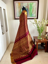 PRANIKA- MAROON KANJIVARAM SAREE WITH VERTICAL GOLD ZARI FLORALS AND PAISLEYS
