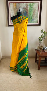 SAMARTHA – BRIGHT YELLOW FLORAL KANJIVARAM WITH PEACOCK BORDER