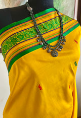 SAMARTHA – BRIGHT YELLOW FLORAL KANJIVARAM WITH PEACOCK BORDER