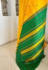SAMARTHA – BRIGHT YELLOW FLORAL KANJIVARAM WITH PEACOCK BORDER