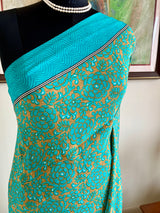 AANYA – DARK BEIGE CREPE SILK WITH BLUE FLORAL DETAILING