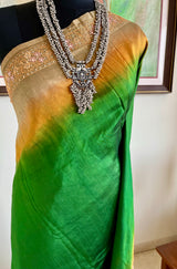 NINARIKA- A BEAUTIFUL GREEN BANARASI SILK SAREE WITH A BROWNISH OMBRE AND SEQUIN EMBROIDERY BORDER