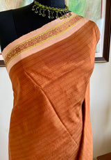 JOVITHA- RUST BROWN KANJIVARAM, SUBTLE CHARM, OFF-WHITE BORDER, VIBRANRT GREEN MOTIFS