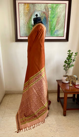 JOVITHA- RUST BROWN KANJIVARAM, SUBTLE CHARM, OFF-WHITE BORDER, VIBRANRT GREEN MOTIFS