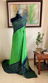 KALVIKA- GREEN KORVAI KANJIVARAM WITH CHEVRON AND RUDRAKSHA OVER NAVY