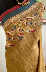 MANUBHA – DARK BEIGE TUSSAR WITH FLORAL PRINTS ON BORDER AND AANCHAL