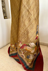 MANUBHA – DARK BEIGE TUSSAR WITH FLORAL PRINTS ON BORDER AND AANCHAL