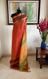 SRUJANA – ORANGE VELDHARI COTTON WITH TEMPLE PEACOCK BORDER