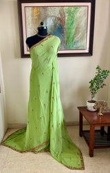 TRISHYA – GREEN PURE GEORGETTE SAREE WITH EMBROIDERY AND SEQUINS