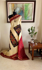 MADHUNISHA- CREAM POCHAMPALLY WITH IKKAT PANELS AND MAROON AANCHAL